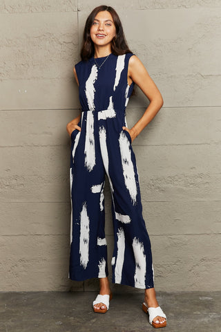 Perfee Printed Round Neck Cutout Jumpsuit with Pockets